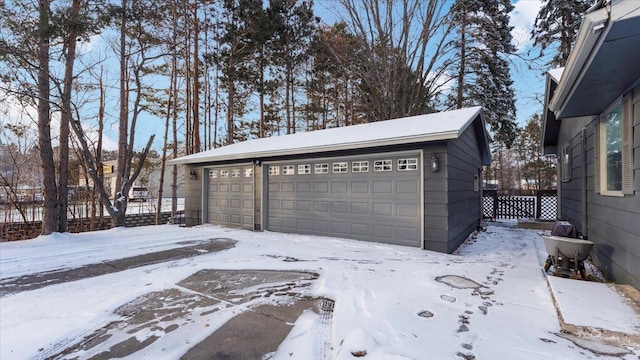 view of snow covered garage