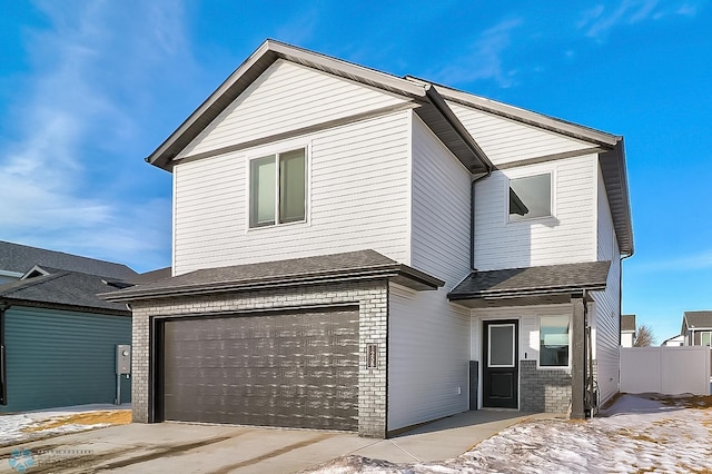 front of property with a garage