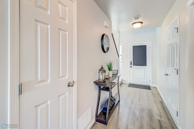 entryway with light hardwood / wood-style flooring