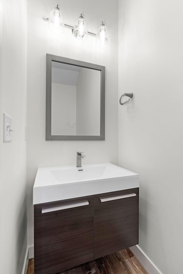 bathroom featuring vanity and wood-type flooring