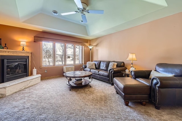 10740 230th St N, Scandia, MN 55073 - living area featuring a raised ceiling, a fireplace, carpet flooring, and a ceiling fan