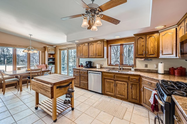 10740 230th St N, Scandia, MN 55073 - kitchen featuring appliances with stainless steel finishes, brown cabinetry, recessed lighting, a ceiling fan, and light tile patterned floors