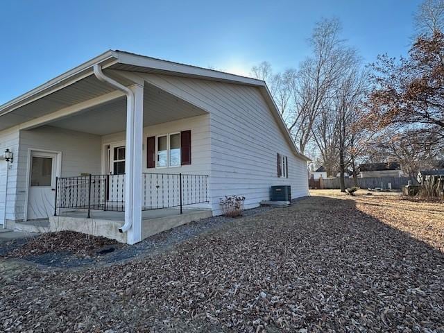 view of side of home with covered porch