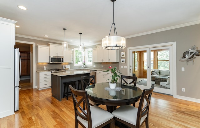 3942 Autumn Lake Ct SW, Rochester, MN 55902 - dining room with light wood finished floors, ornamental molding, french doors, and recessed lighting
