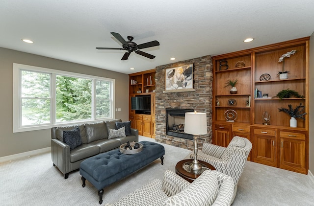 3942 Autumn Lake Ct SW, Rochester, MN 55902 - living room with light carpet, ceiling fan, recessed lighting, and a stone fireplace