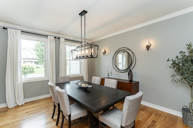 3942 Autumn Lake Ct SW, Rochester, MN 55902 - dining room with light wood-style floors, plenty of natural light, crown molding, and a chandelier