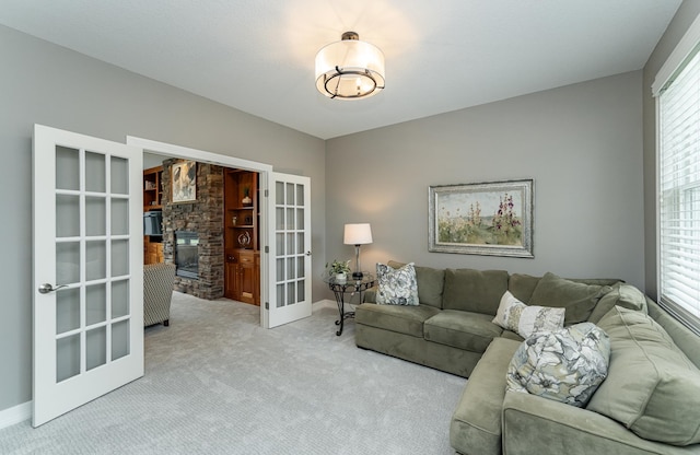3942 Autumn Lake Ct SW, Rochester, MN 55902 - living room featuring french doors, carpet flooring, and healthy amount of natural light