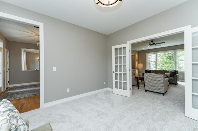 3942 Autumn Lake Ct SW, Rochester, MN 55902 - living area with french doors, carpet flooring, and ceiling fan
