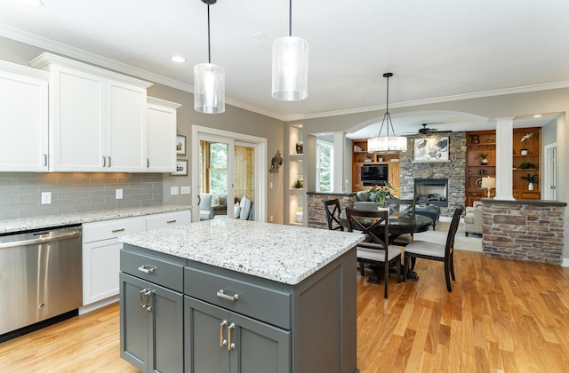 3942 Autumn Lake Ct SW, Rochester, MN 55902 - kitchen featuring stainless steel dishwasher, a ceiling fan, light wood finished floors, a fireplace, and gray cabinets