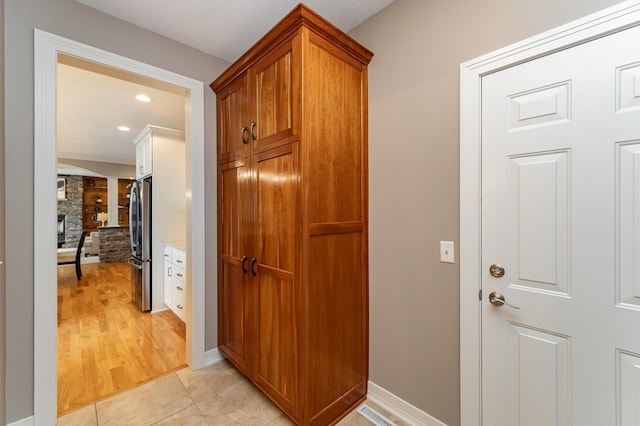 3942 Autumn Lake Ct SW, Rochester, MN 55902 - hall featuring light tile patterned floors and recessed lighting