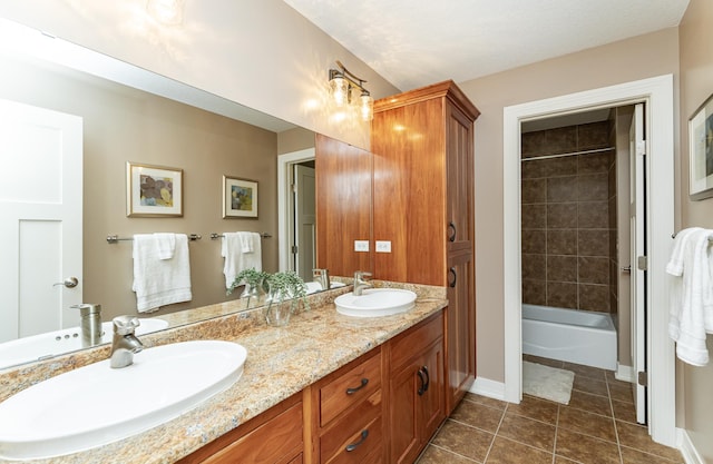 3942 Autumn Lake Ct SW, Rochester, MN 55902 - bathroom with double vanity, tile patterned floors, and shower / tub combination