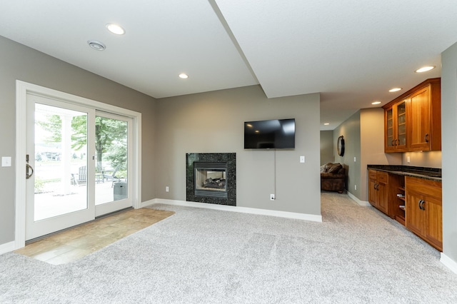 3942 Autumn Lake Ct SW, Rochester, MN 55902 - unfurnished living room with light colored carpet, recessed lighting, and a high end fireplace