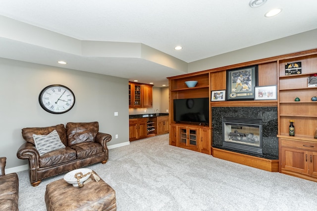 3942 Autumn Lake Ct SW, Rochester, MN 55902 - living room with light carpet, recessed lighting, a fireplace, and bar