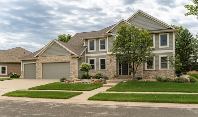 3942 Autumn Lake Ct SW, Rochester, MN 55902 - craftsman house featuring stone siding, an attached garage, concrete driveway, and a front lawn