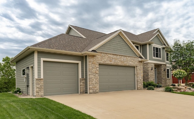 3942 Autumn Lake Ct SW, Rochester, MN 55902 - craftsman-style house featuring an attached garage, driveway, stone siding, and roof with shingles