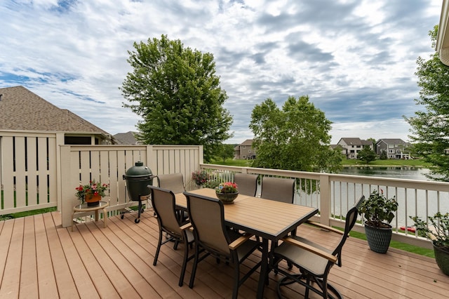 3942 Autumn Lake Ct SW, Rochester, MN 55902 - wooden terrace with a water view, outdoor dining area, and area for grilling