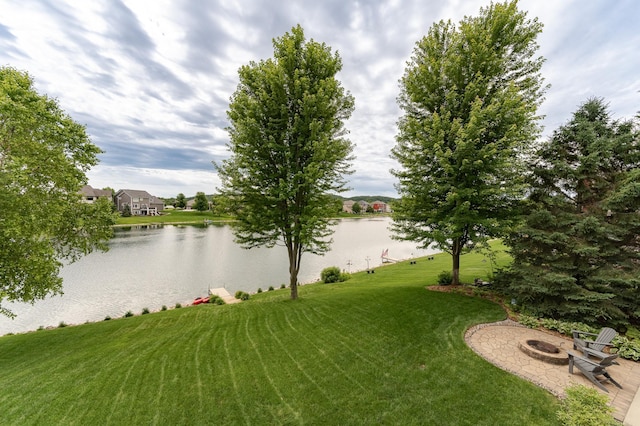 3942 Autumn Lake Ct SW, Rochester, MN 55902 - view of grassy yard with a fire pit and a water view