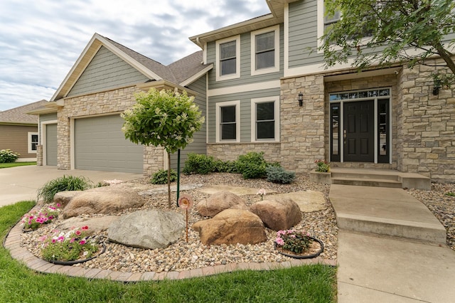 3942 Autumn Lake Ct SW, Rochester, MN 55902 - view of front of house with stone siding, concrete driveway, and an attached garage