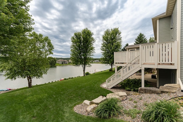 3942 Autumn Lake Ct SW, Rochester, MN 55902 - view of grassy yard featuring stairway and a deck with water view