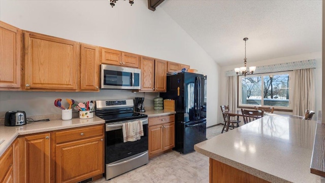 kitchen with decorative light fixtures, a notable chandelier, appliances with stainless steel finishes, and light countertops