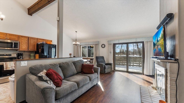 living room featuring wood finished floors, high vaulted ceiling, an inviting chandelier, beam ceiling, and a textured ceiling