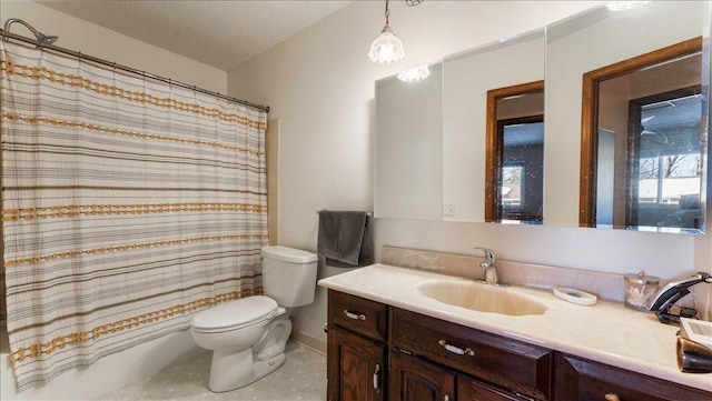 bathroom featuring vanity, tile patterned flooring, shower / bath combo with shower curtain, a textured ceiling, and toilet