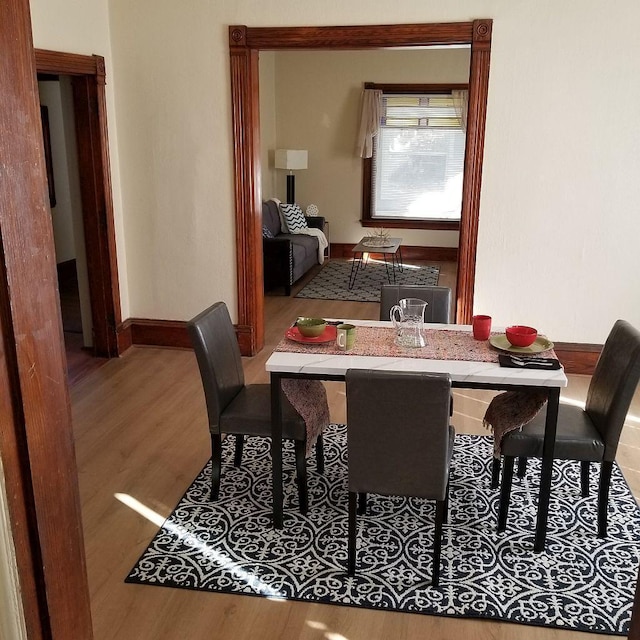 dining area with wood-type flooring