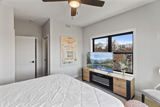 carpeted bedroom featuring ceiling fan