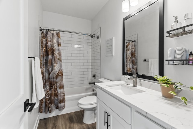 full bathroom featuring shower / bath combo, wood-type flooring, vanity, and toilet