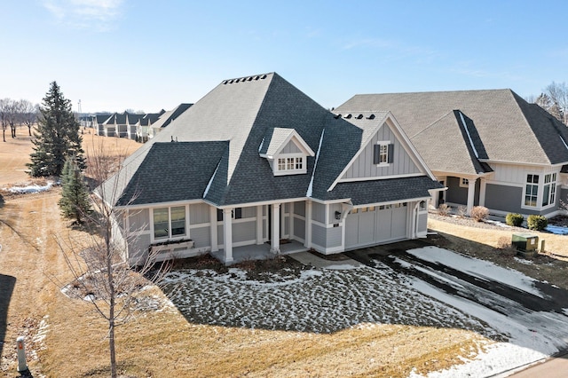 view of front of house with a shingled roof and board and batten siding