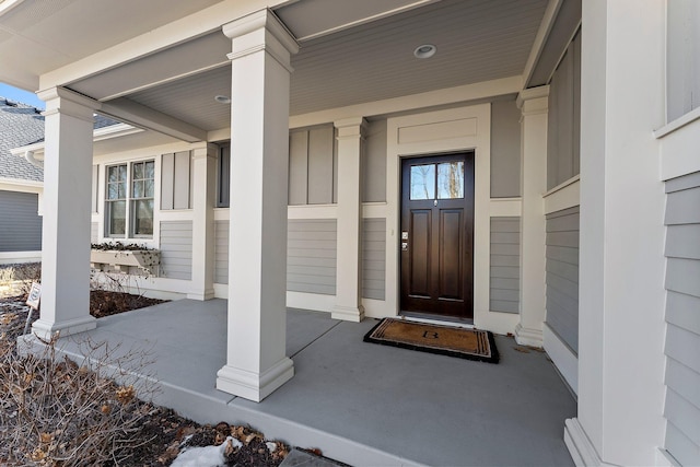 doorway to property featuring a porch