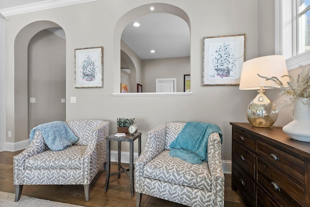 sitting room with baseboards, wood finished floors, and recessed lighting