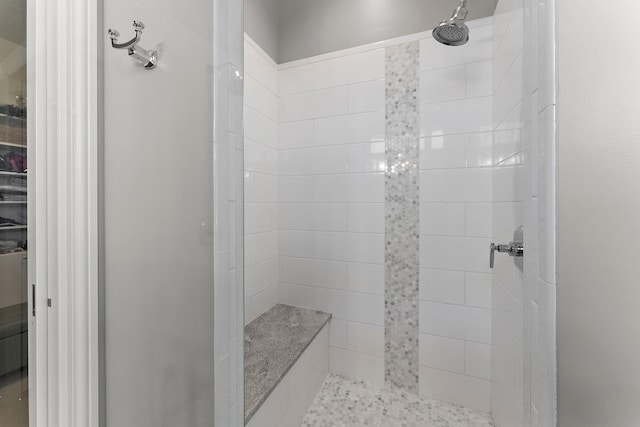 bathroom featuring tiled shower