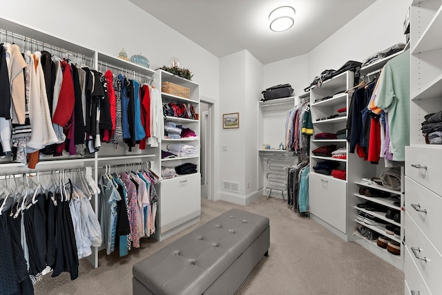 walk in closet featuring carpet flooring and visible vents