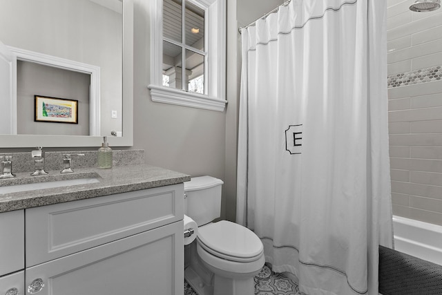 bathroom with vanity, toilet, and shower / tub combo with curtain