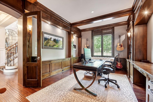 home office featuring dark wood-type flooring and crown molding