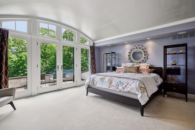 carpeted bedroom with lofted ceiling, access to exterior, and multiple windows