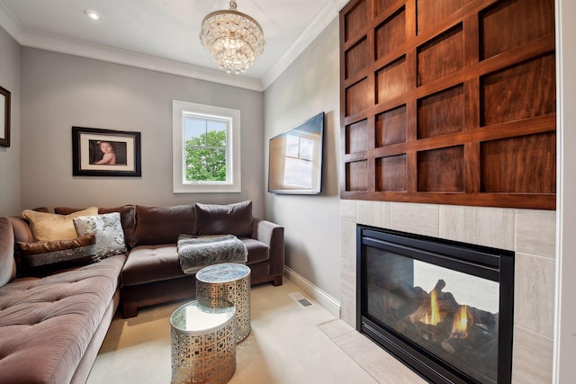 living room with crown molding, light colored carpet, a notable chandelier, and a fireplace