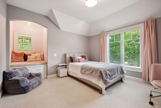 bedroom featuring light colored carpet