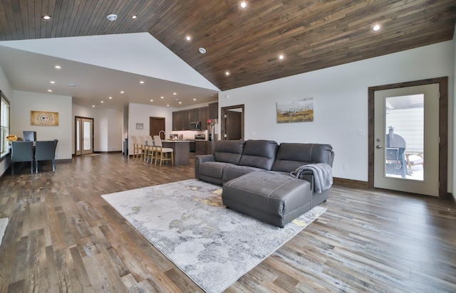 living room with hardwood / wood-style flooring, wood ceiling, and high vaulted ceiling