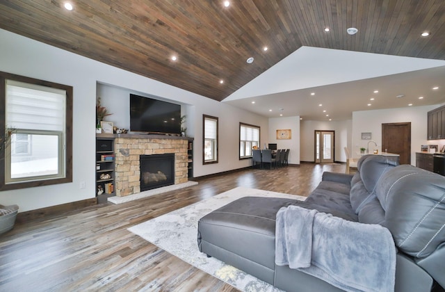 living room with wood ceiling, light hardwood / wood-style flooring, and high vaulted ceiling