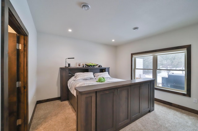 bedroom featuring light colored carpet