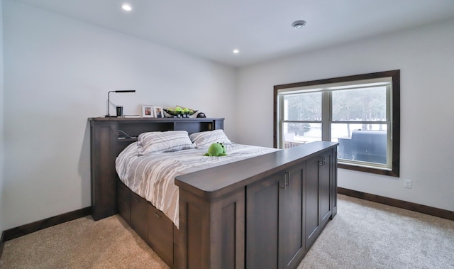 bedroom featuring light colored carpet