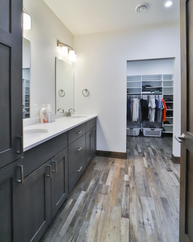 bathroom featuring vanity and hardwood / wood-style floors