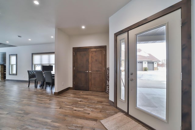 foyer with dark hardwood / wood-style floors