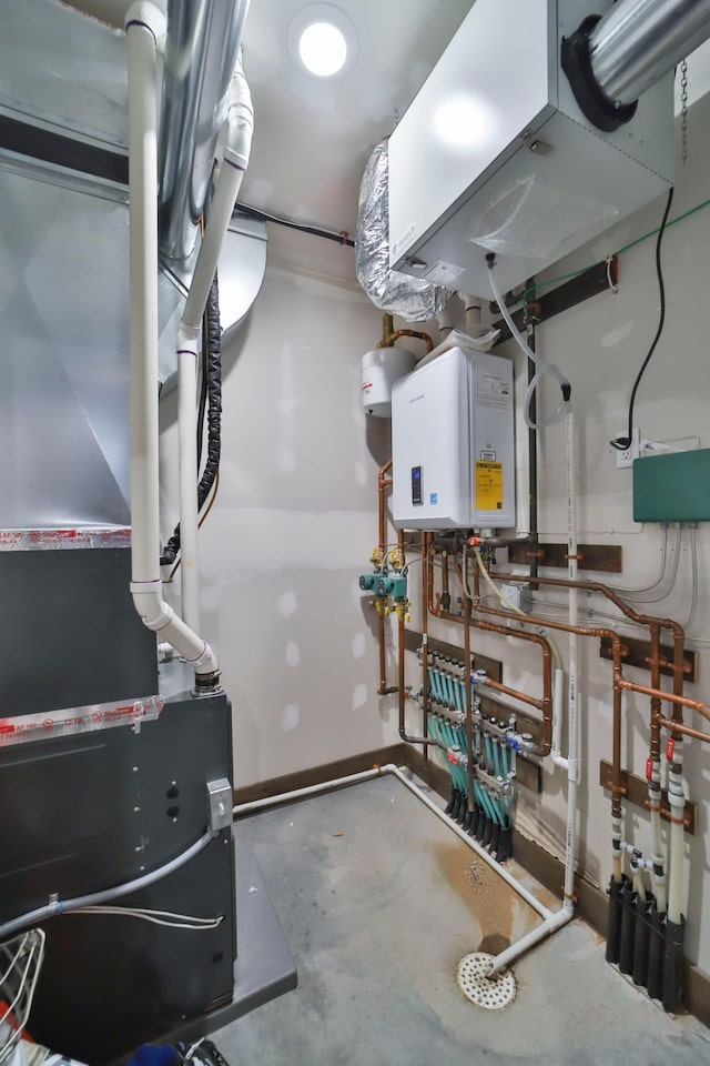 utility room featuring heating unit and tankless water heater