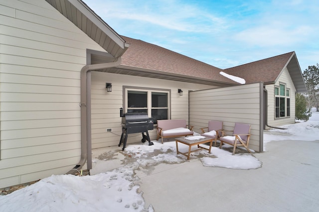 snow covered patio featuring area for grilling