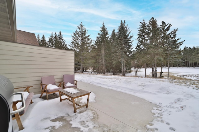 view of snow covered patio