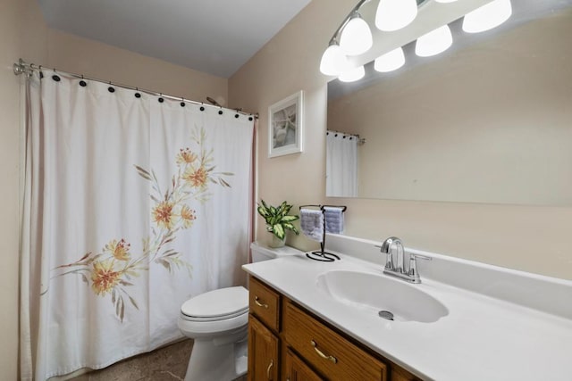 bathroom featuring toilet, a shower with shower curtain, and vanity