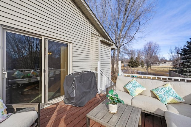 wooden terrace with outdoor lounge area and a grill